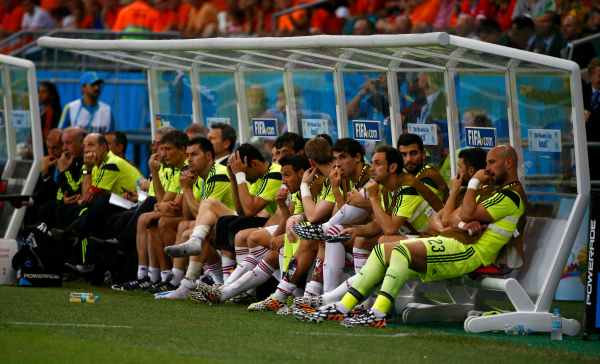 Spain's players react on the bench during their 2014 World Cup Group B soccer match against the Netherlands at the Fonte Nova arena in Salvador